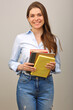 © Yuriy Shevtsov - Teacher woman or student girl holding books. Isolated female portrait.