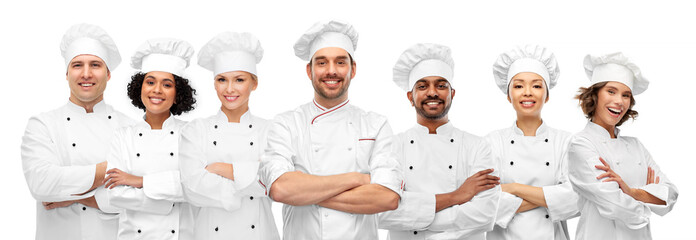 Sticker - cooking, culinary and profession concept - international team of smiling chefs with crossed arms