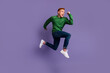 © Tetiana - Full size profile side photo of young man runner jumper rush fast discount isolated over violet color background