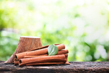 Cinnamon Bark And Green Leaf On Nature Background.