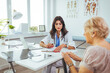 © Dragana Gordic - Cropped shot of an attractive young female doctor consulting with a patient inside her office at a hospital. Female doctor looking at test results of her patient.
