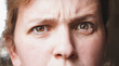 close up of a woman face with a distrust expression in her face