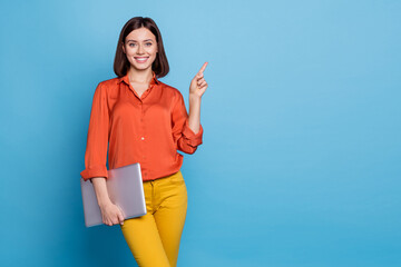 Wall Mural - Portrait of attractive cheerful skilled girl holding laptop showing copy empty space ad isolated over bright blue color background