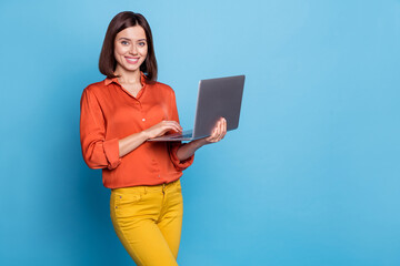 Wall Mural - photo of young woman use laptop project workshop representative expert isolated over blue color back