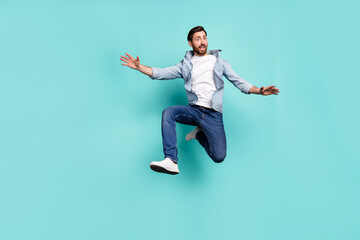 Sticker - Full body photo of satisfied sportive person jumping enjoy free time isolated on teal color background