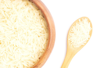 Wall Mural - Long Basmati rice in wooden bowl with spoon on white background isolated. Macro. Flat lay. Healthy eating concept