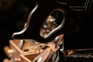 Collection of various antique wood working tools and hand tools in vintage wooden carpenter's tool box