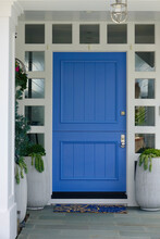 Closeup Of Blue Front Door To Modern Farmhouse