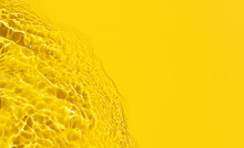 Yellow Abstract Background Texture With Water Ripples And Waves. Copy Space. Top View