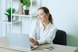 © st.kolesnikov - girl holding online meeting or class in online school