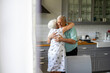 © pikselstock - Senior Couple Hugging in their Kitchen