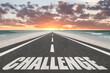 © Jay Koppelman - Challenge text written on a beach highway at sunset.
