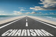 © Jay Koppelman - The word Charisma written on a highway at the beach at sunset.
