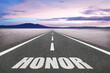 © Jay Koppelman - The word Honor on a road leading to the horizon for nobility concept.