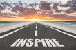 © Jay Koppelman - Inspire text on a highway leading to success for inspirational concept.