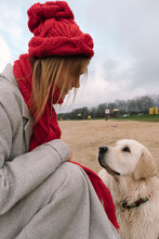 Portrait Of A Girl In Profile Next To Her Labrador Dog 