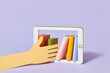 © Yaroslav Danylchenko/Stocksy - Hand takes books from tablet
