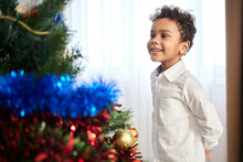 Children Decorate The Christmas Tree 