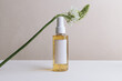 © Sophia Hsin/Stocksy - Still life of beauty product with flower