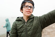 © Maria Manco/Stocksy - profile of boy in glasses and backwards hat