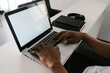 © Ezequiel Giménez/Stocksy - Crop black guy working remotely on laptop at home