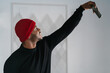 © Ezequiel Giménez/Stocksy - Smiling black guy taking selfie on smartphone