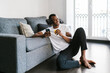© Ezequiel Giménez/Stocksy - Black meloman enjoying juice at home