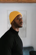 © Ezequiel Giménez/Stocksy - Thoughtful black man looking away