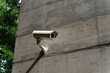 © Alba Vitta/Stocksy - security camera on concrete wall