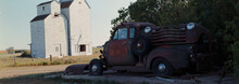 Grain Elevator And Abandoned Truck