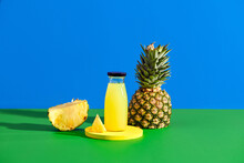 Delicious Pineapple Juice And Fresh Fruit On Color Background