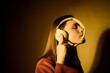 © Producciones Visualix/Stocksy - Girl listening to music with headphones