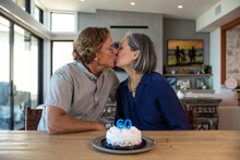 Couple Celebrates With Birthday Cake