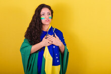 Woman Soccer Fan, Fan Of Brazil, World Cup, Singing The National Anthem. Hand On Chest.