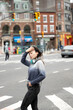 © Lauren Lee/Stocksy - Woman with headphones in city