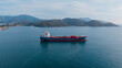 © Yakov Knyazev/Stocksy - aerial view of an oil tanker moving along the coast