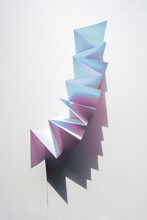 Folded Paper With Colourful Shadows