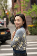 © Lauren Lee/Stocksy - Happy woman in neighborhood