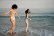 © Malquerida Studio/Stocksy - Women friends enjoying in the seashore