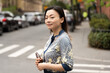 © Lauren Lee/Stocksy - Woman walking in the city