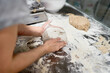 © Javier Díez/Stocksy - Crop woman making loafs from dough