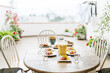 © Mal de Ojo Studio/Stocksy - Table set with food at a terrace