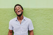 © VICTOR TORRES/Stocksy - Cheerful positive man laughing at camera