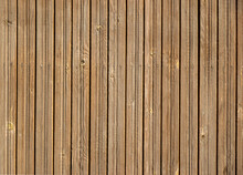 Texture Of A Wooden Brown Fence With Nails In A Row