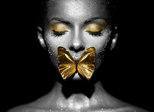 Fashion Model Woman In Bright Sparkles And Lights Posing In Studio. Portrait Of Beautiful Sexy Woman With Butterfly. Art Design Glitter Glowing Make Up. Black And White Photography