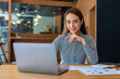 © crizzystudio - Portrait of beautiful asian woman working financial report with laptop computer at office.
