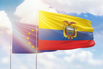 Sunny blue sky and flags of ecuador and european union