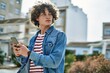 © Krakenimages.com - Young hispanic man using smartphone at the city