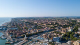 Fototapeta Do pokoju - Italy, June 2022; aerial view of Fano with its sea, beaches, port, umbrellas in the marche region