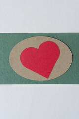 Poster - red heart on oval shape on green and gray paper background